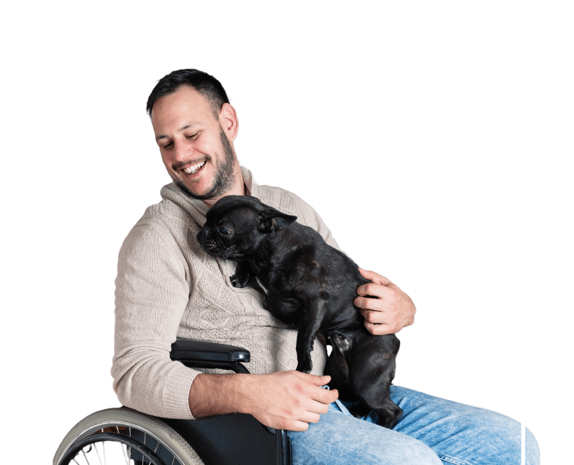 man in wheelchair patting dog