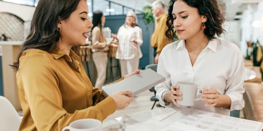 two people talking over a coffee