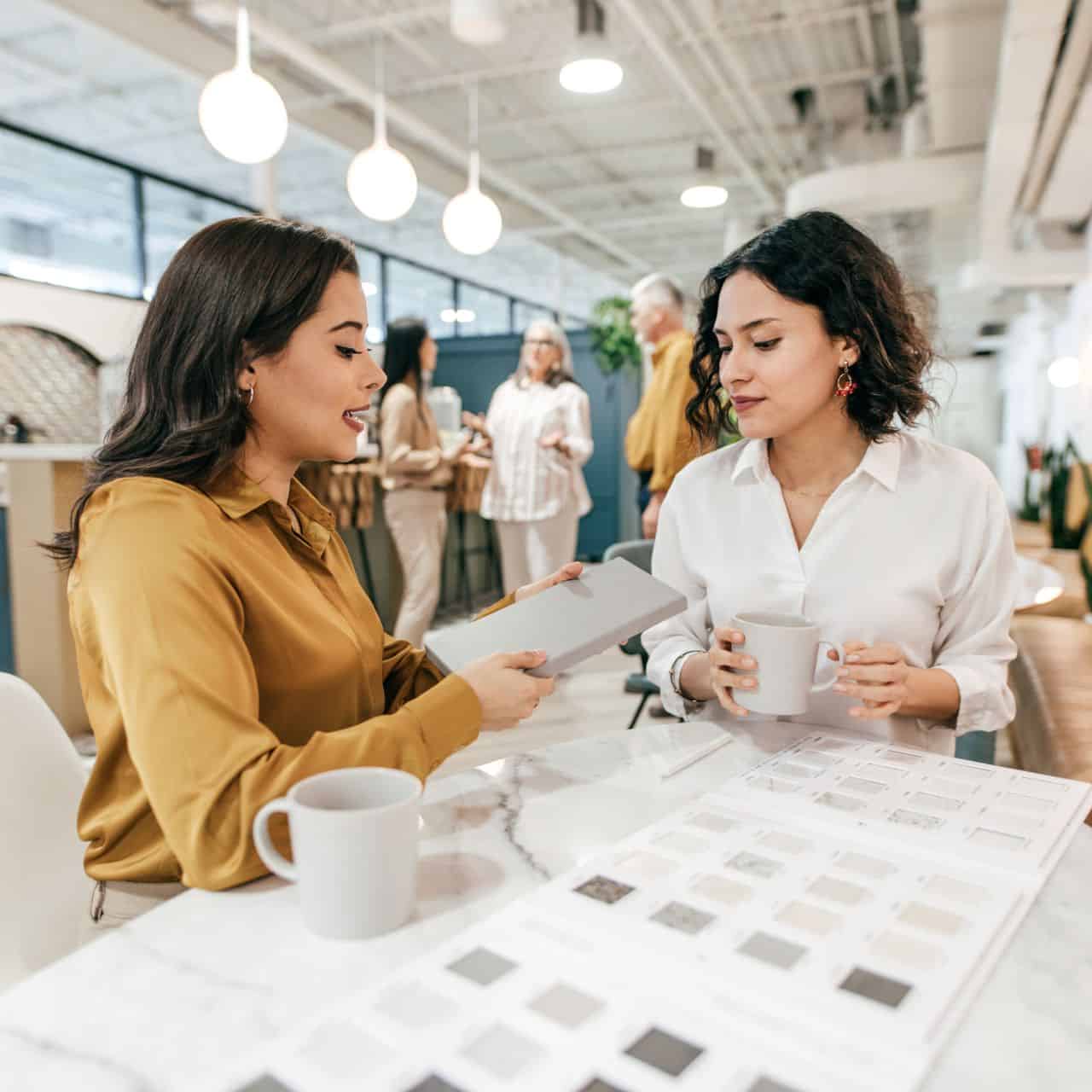 two people talking over a coffee