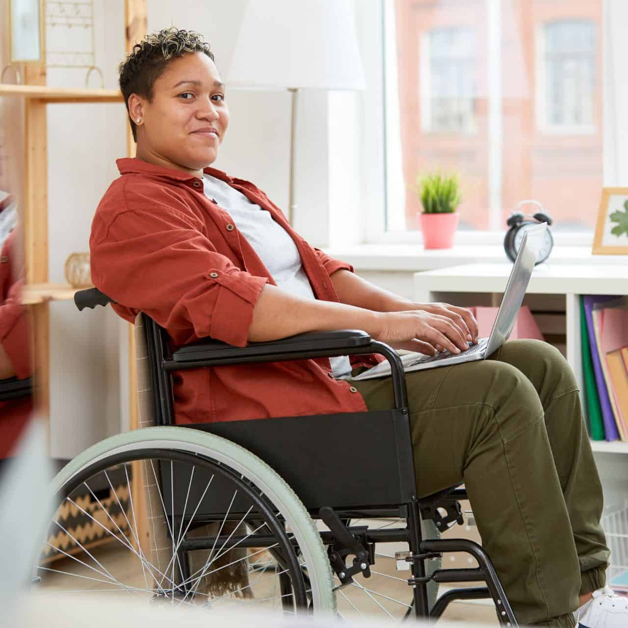 woman in a wheelchair on laptop