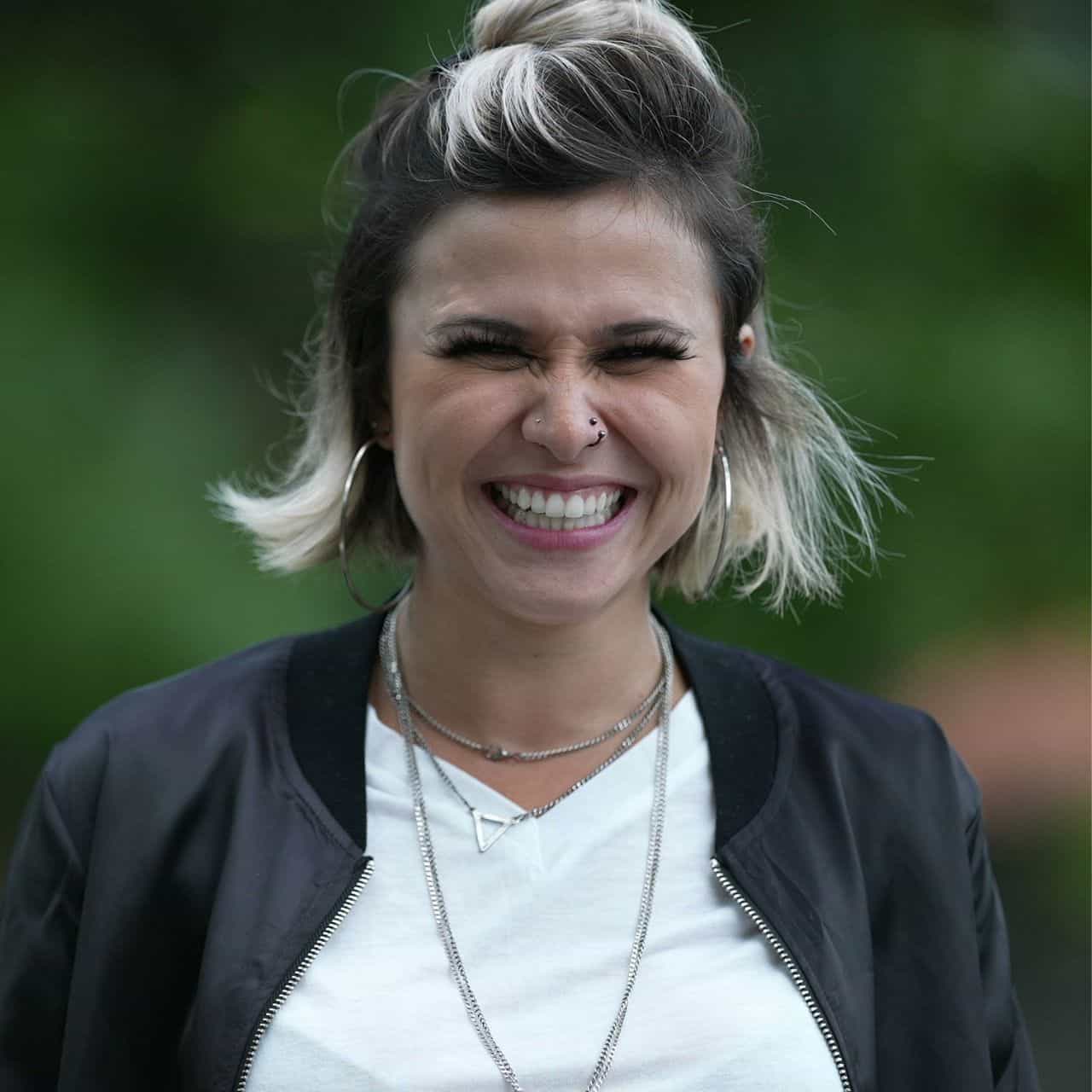 woman looking at camera with big grin