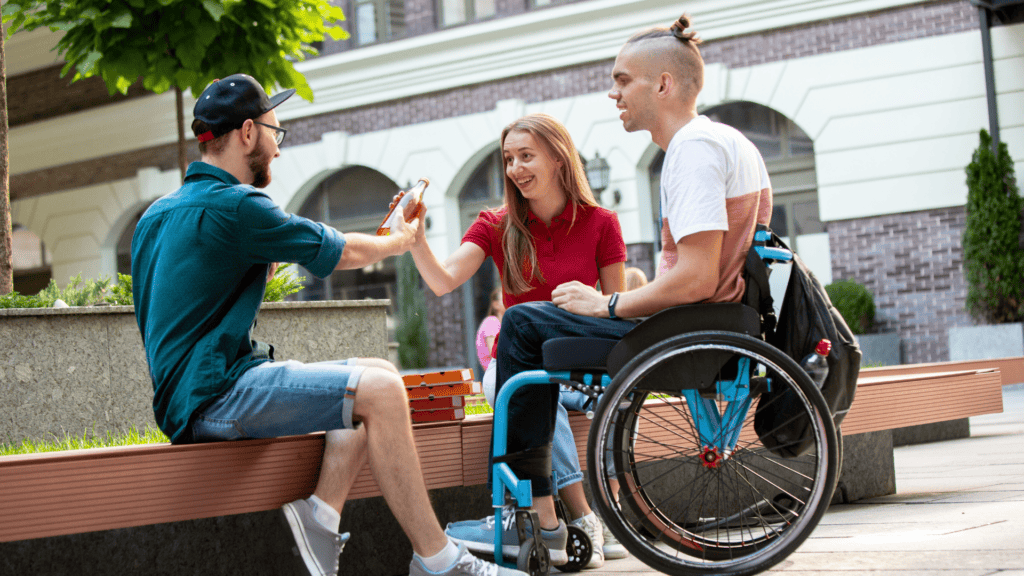 person in wheelchair spending time with friends